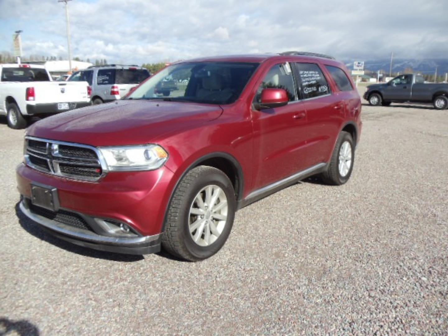 2014 red /Tan Dodge Durango SXT (1C4RDJAG5EC) with an 3.6 L VVT 6 Cylinder engine, Automatic transmission, located at 5465 Highway 2 W., Columbia Falls, MT, 59912, (406) 892-4407, 48.352188, -114.240929 - This SUV was previously owned by the federal government so it has been well maintained and taken care of. This Durango is super clean inside and out with near new tires and low actual miles. This vehicle is a 7 passenger. - Photo#2